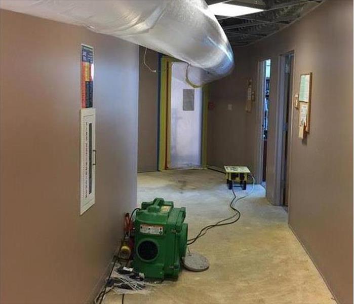 overhead poly duct, air scrubber in hallway, no carpet